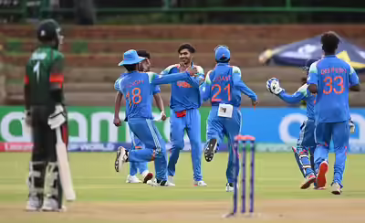 Vihaan malhotra celebrates with teammates.jpg