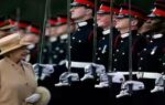 queen elizabeth made prince harry crack a smile at a military parade in 2006