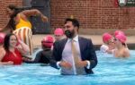 zohran mamdani dives into nyc pool in suit
