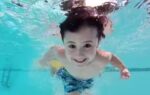 child swimming underwater