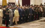new delhi dignitaries stand for the national anthem during the national sports