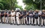 police personnel stand guard near