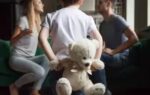 rear view at kid boy holding toy while parents fighting