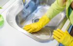 woman cleaning sink