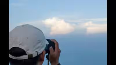 man watching clouds