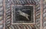 a panel of the mosaic depicts a dog named ocean