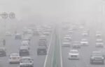 file photo traffic moves along a highway amidst air pollution in new delhi india