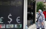 iraq devalues its currency