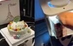 man wakes up to a birthday cake delivered by a robot at a hotel