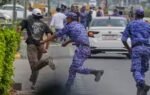 security personell nabbing protester during cjp protest