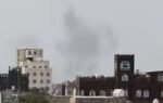 smoke rises after reports of an airstrike hitting near the sanaa international airport